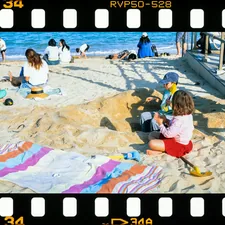 Children playing with sand on a sunny beach. related to Transform Your Sleep Space with Fun Bed Sheets