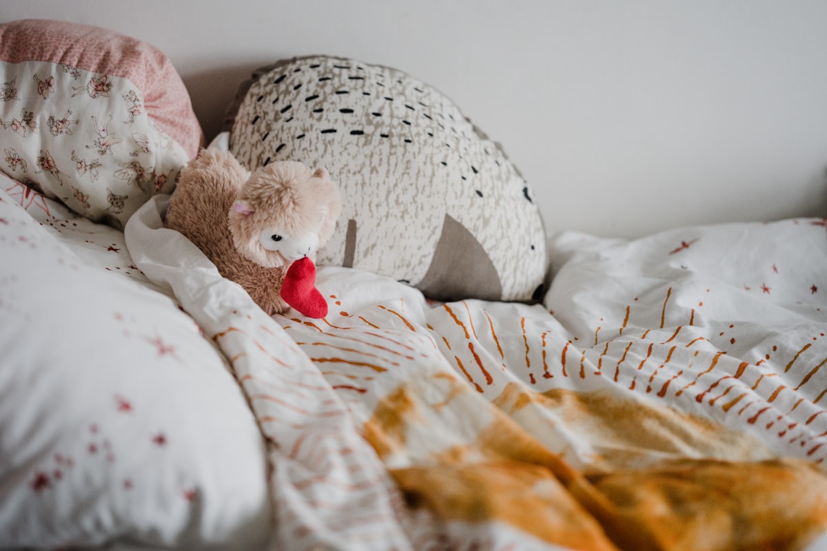 Childs bed with teddy llama, daily routine related to Cutest Baby Girl Bedding Trends to Follow in 2024