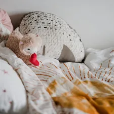 Childs bed with teddy llama, daily routine related to Cutest Baby Girl Bedding Trends to Follow in 2024