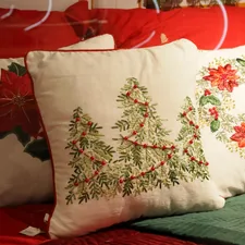 Christmas pillows with poinsettias and trees related to Deck the Halls with Christmas Bedding from Target