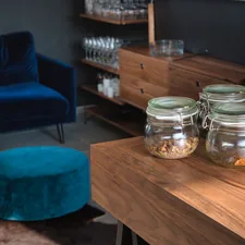 clear glass jar on brown wooden table related to Elevate Your Dining Room with Walnut Sideboards and Buffets