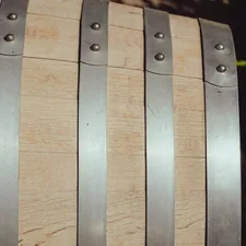 Close-up of a wooden barrel with metal bands related to Crate and Barrel Bed Frame: A Guide to Choosing the Perfect One