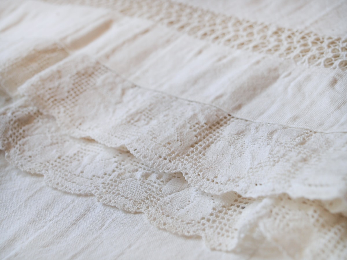 Close up photo of a lace tablecloth related to Shabby Chic Valances