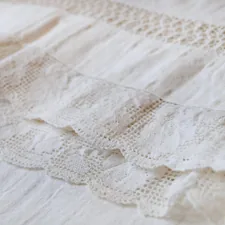 Close up photo of a lace tablecloth related to Shabby Chic Valances