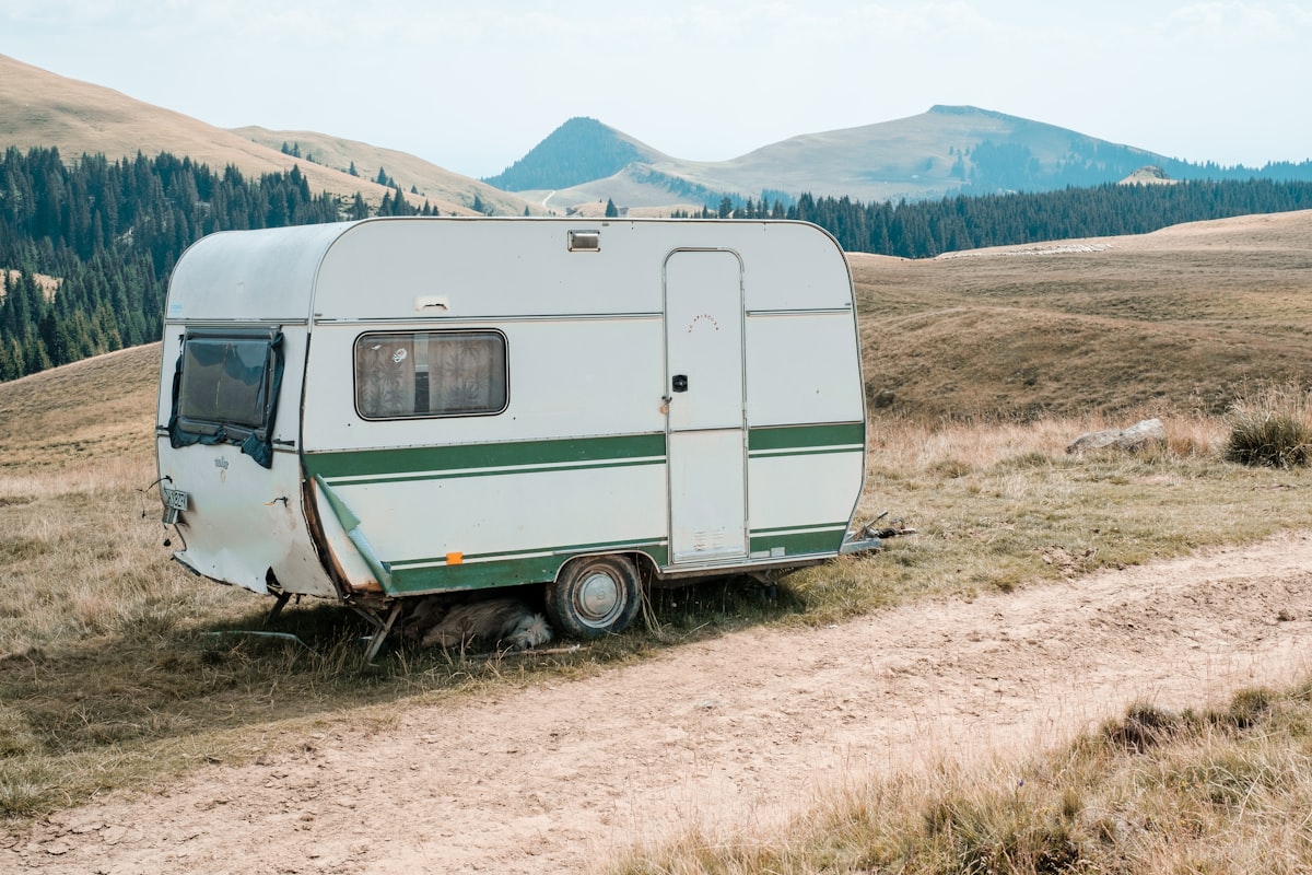 closed white camping trailer during daytime related to Exploring the Best Travel Trailers with Bunk Beds