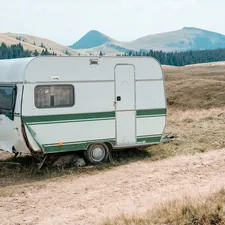 closed white camping trailer during daytime related to Exploring the Best Travel Trailers with Bunk Beds