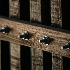 Closeup shot of a wooden handmade gate with rustic wood and metal screws related to The Ultimate Guide to Bed Frames with Hooks