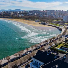 Coastal city skyline with a beach and ocean waves. related to Discover the Best Bed and Breakfasts in Ocean City, MD for Your Perfect Getaway