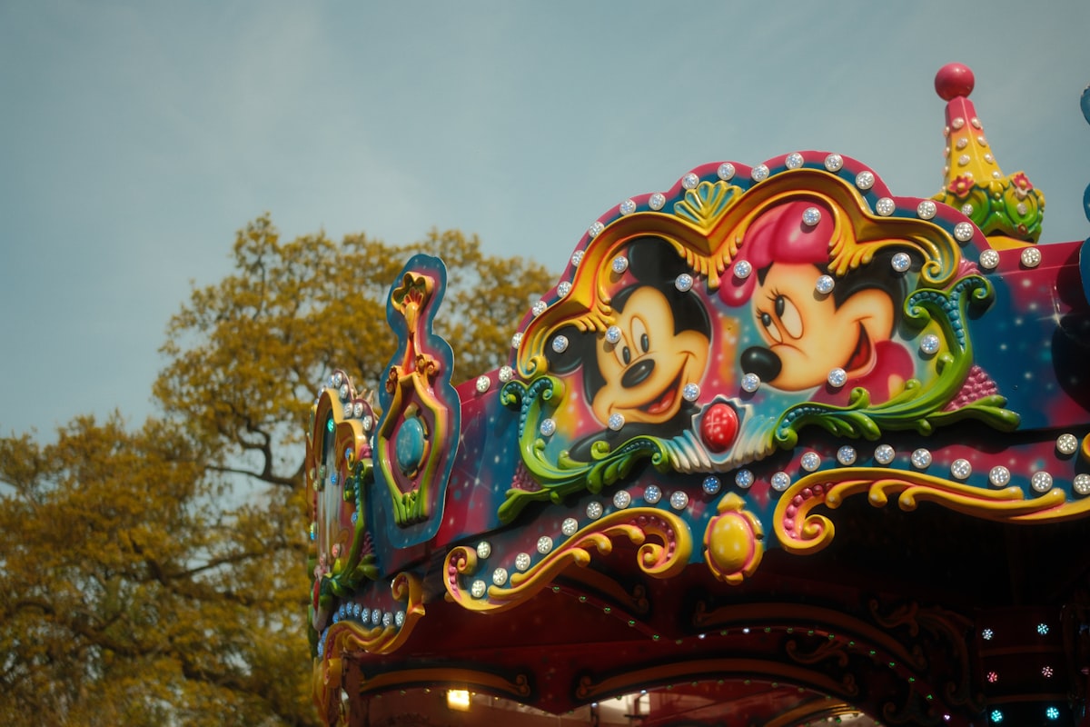 Colorful carousel with mickey and minnie mouse decorations related to Dreaming of Disney: The Ultimate Guide to Minnie Mouse Bed