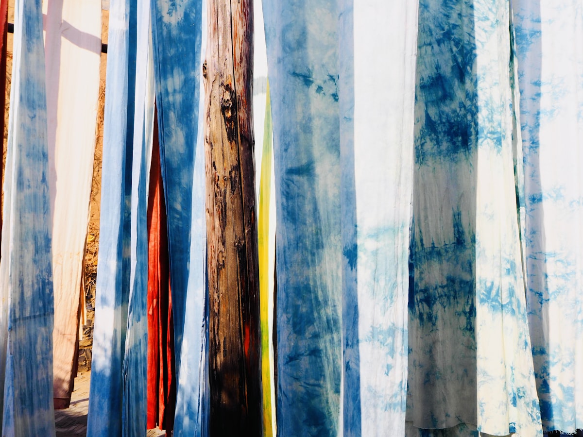 Colorful fabrics hanging and drying in sunlight. related to Tie Dye Bed Sheets: A Burst of Color for Your Bedroom Oasis