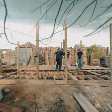 construction workers building a scene related to Nurturing Thriving Vegetation with Raised Beds