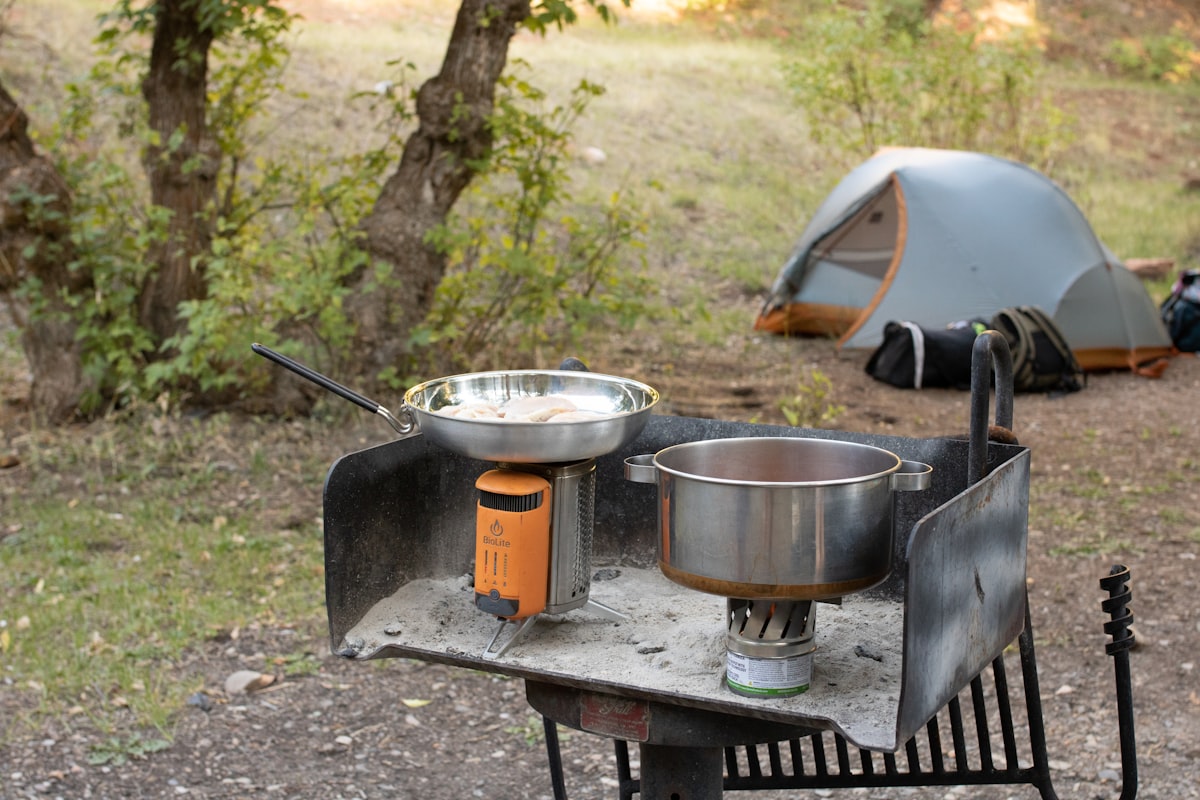 Cooking food in the wilderness with a BioLite during a camping trip related to Outdoor Cooking Chiminea