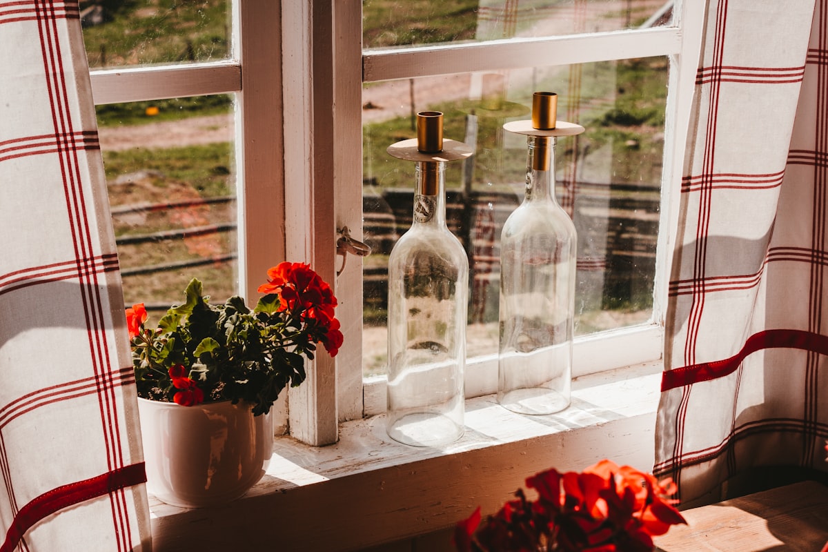 Cozy window sill in sweden related to Elevate Your Window Decor with a Navy Blue and White Valance