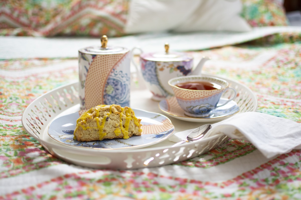 cup of tea and bread with dressing related to Discover the Charm of Cape May: A Bed and Breakfast Getaway