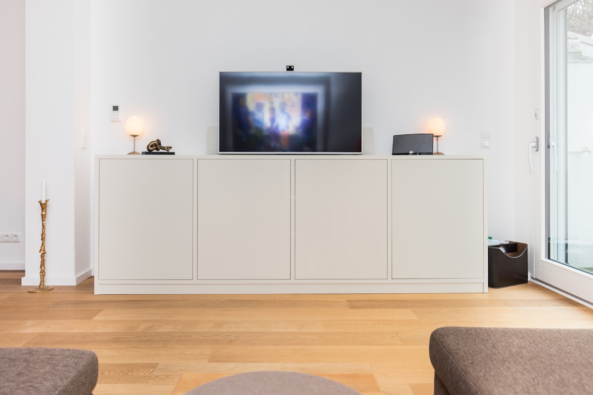 Custom made sideboard with an integrated TV. Made by the carpenters of Pickawood. related to The Ultimate Guide to Elevating Your Space with a Sideboard Buffet Table