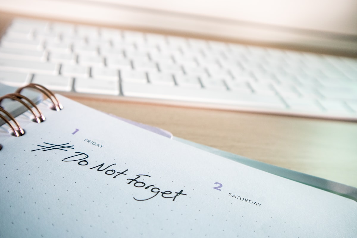 Desk with a keyboard and a diary with the hashtag #DoNotForget on it related to Techniques to Improve Stamina and Endurance in Intimacy