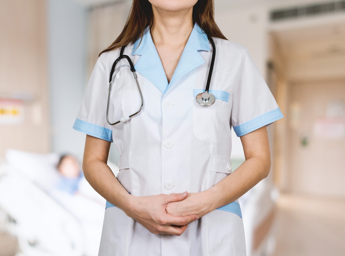 Detail of stethoscope. Doctor woman with white coat and stethoscope. related to Decoding Hospital Bed Pricing: A Comprehensive Guide