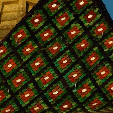 Detailed patterned roof tiles on a building related to Ultimate Guide to Minecraft Bedding