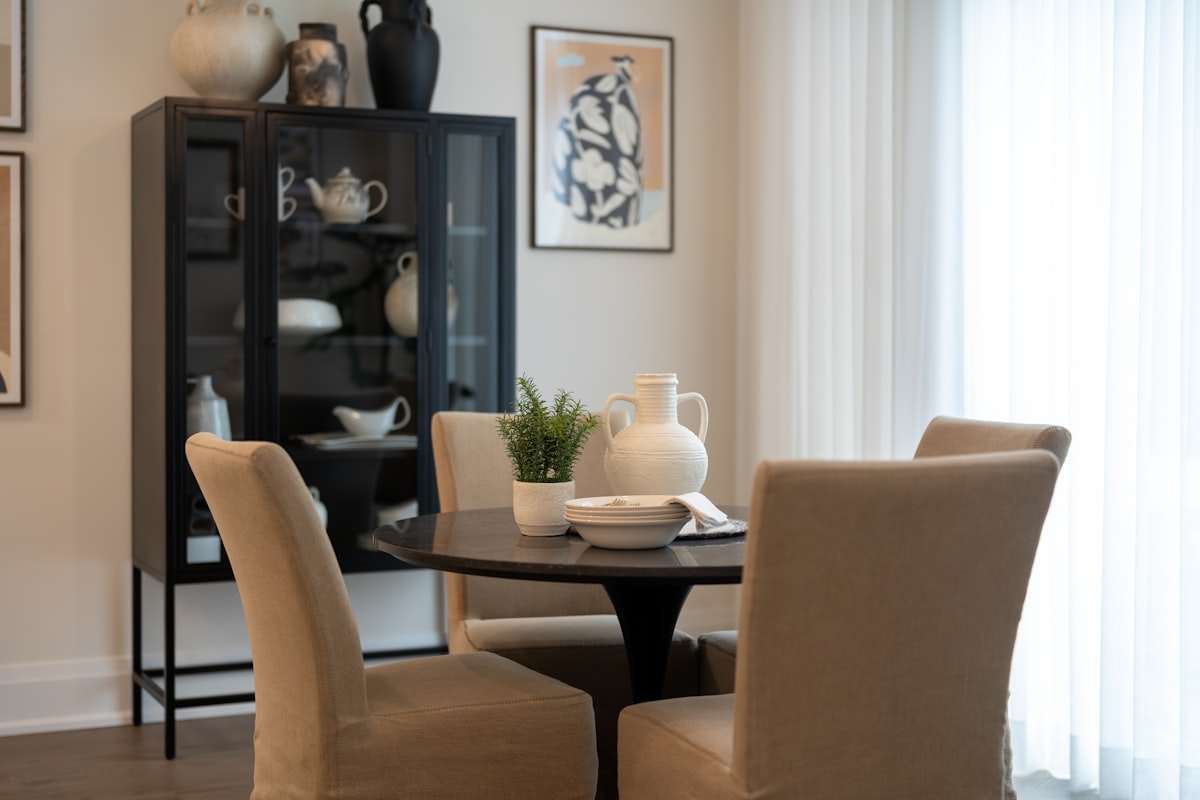 Dining table with chairs and a cabinet related to Elevate Your Dining Experience: Choosing the Perfect Sideboard