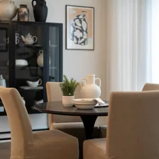 Dining table with chairs and a cabinet related to Elevate Your Dining Experience: Choosing the Perfect Sideboard