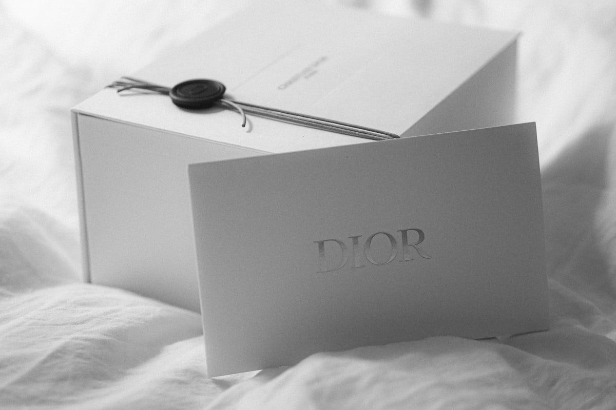 Dior gift box with a card on white fabric related to Sweet Dreams with Ever After High Bedding