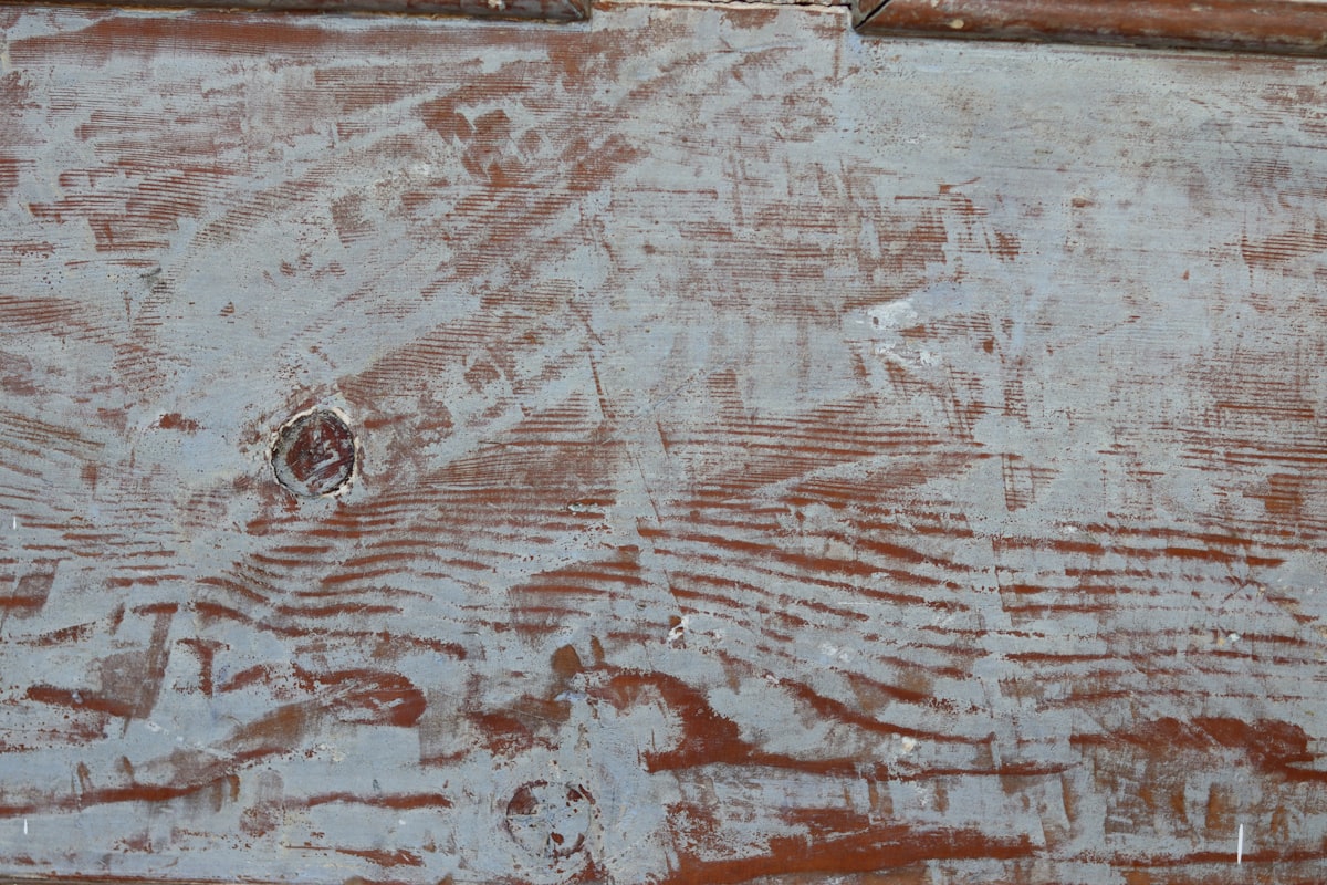 Distressed wood surface with faded paint. related to Crafting Charisma: Distressed Wood Sideboards for the Home