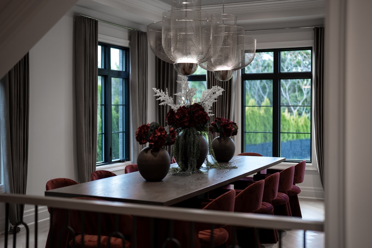 Elegant dining room with large table and red chairs related to Velvet Valances for Windows