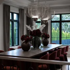 Elegant dining room with large table and red chairs related to Velvet Valances for Windows