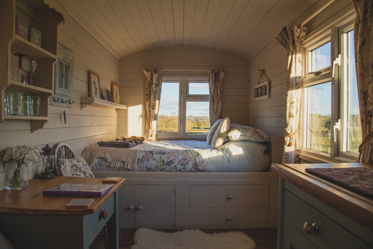 empty bed beside windows during daytime related to Cozy Up Your Bedroom with Country Bedding Sets