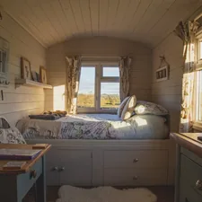 empty bed beside windows during daytime related to Cozy Up Your Bedroom with Country Bedding Sets