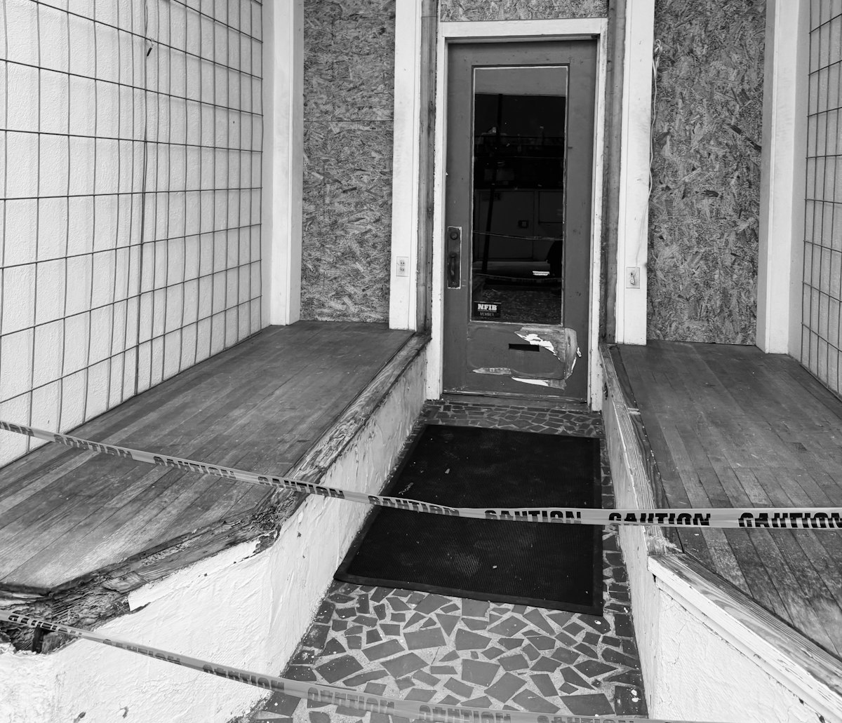 Entrance to building with caution tape related to Stylish Seating for a Welcoming Entryway