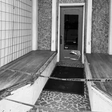 Entrance to building with caution tape related to Stylish Seating for a Welcoming Entryway