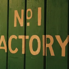 Factory sign in mill related to From Factory Floors to Cozy Canine Corner: The Dallas Manufacturing Company Creating Custom Dog Beds