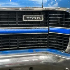 Ford nameplate on a vintage American car related to Ford F150 Front Bumper Valance