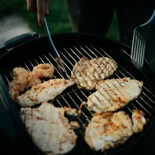 fried food on black pan related to Chiminea Cooking Accessories: Enhancing Your Outdoor Cooking Experience
