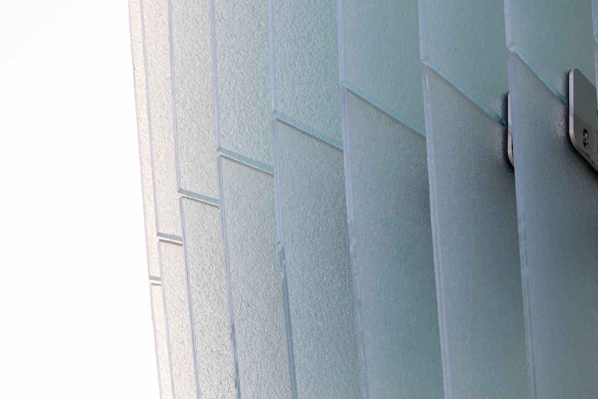 Frosted glass panels with metal fasteners related to Vertical Blind Valances: Elevate Your Window Style