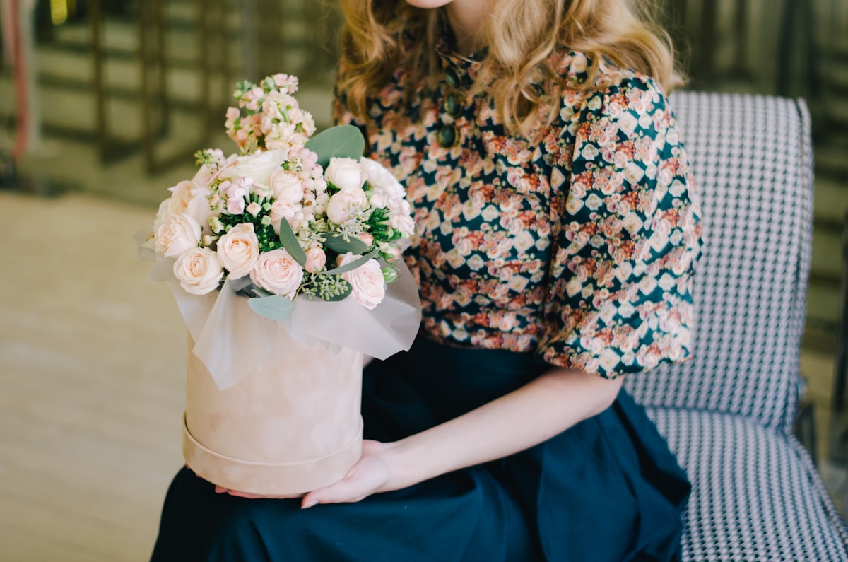 Girl with a beautiful bouquet related to Elevate Your Style with Floral Valances for Windows