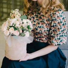 Girl with a beautiful bouquet related to Elevate Your Style with Floral Valances for Windows