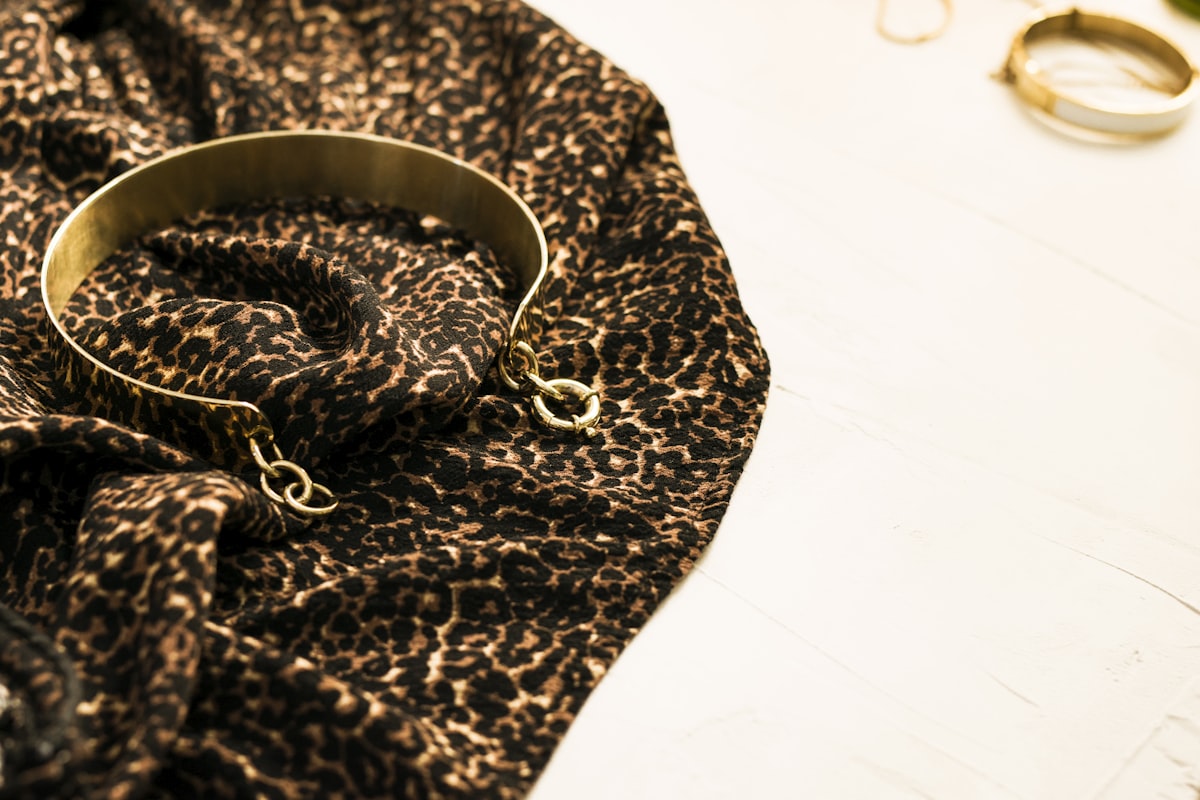 Gold bangle on leopard print cloth related to Leopard Print Valance