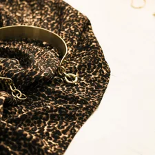 Gold bangle on leopard print cloth related to Leopard Print Valance