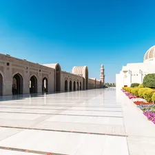 Grand mosque courtyard with arched walkways, dome, and gardens. related to Beautiful Flower Bed Designs for the Front of Your House