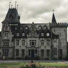 gray and black concrete building during daytime related to Enchanting Escapes: Discovering the Charm of Castle Bed and Breakfasts