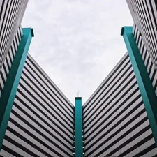 gray concrete building under white clouds during daytime related to Transform Your Bedroom with Black, White, and Turquoise Bedding