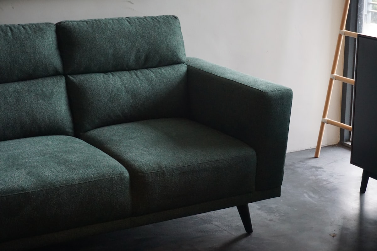 gray cushion armchair beside white wall related to The Ultimate Comfort: Exploring Tempurpedic Sofa Beds