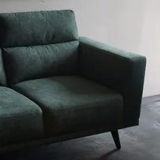 gray cushion armchair beside white wall related to The Ultimate Comfort: Exploring Tempurpedic Sofa Beds