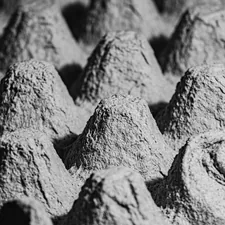 gray scale photo of rock formation related to Understanding Bed Egg Crate Foam and Its Benefits