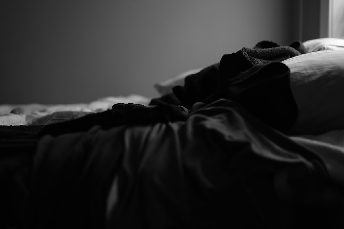 grayscale photo of bed linen related to Black and White Coverlet: The Perfect Blend of Elegance