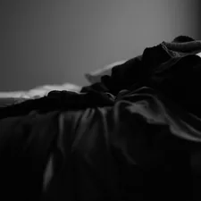 grayscale photo of bed linen related to Black and White Coverlet: The Perfect Blend of Elegance