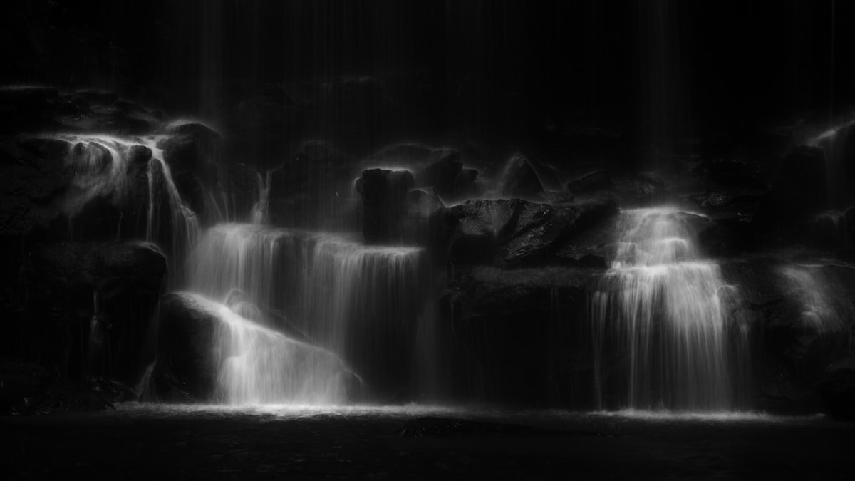 grayscale photo of water falls related to Black Waterfall Valance: Add Drama & Sophistication to Your Space