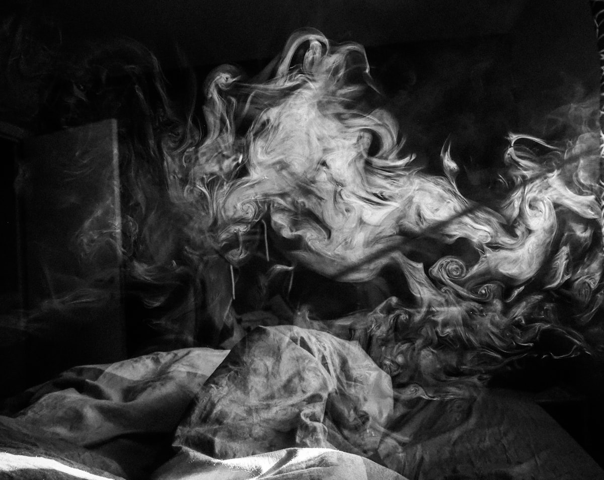 grayscale photo of woman in dress related to The Burning Bed: A Symbol of Resistance and Rebirth